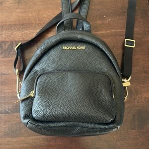 Micheal Kors black backpack.